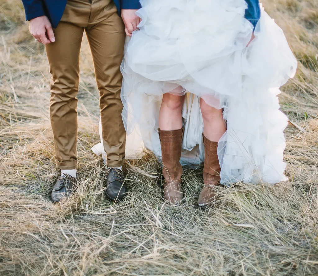 couple-in-boots-in-hay-field
